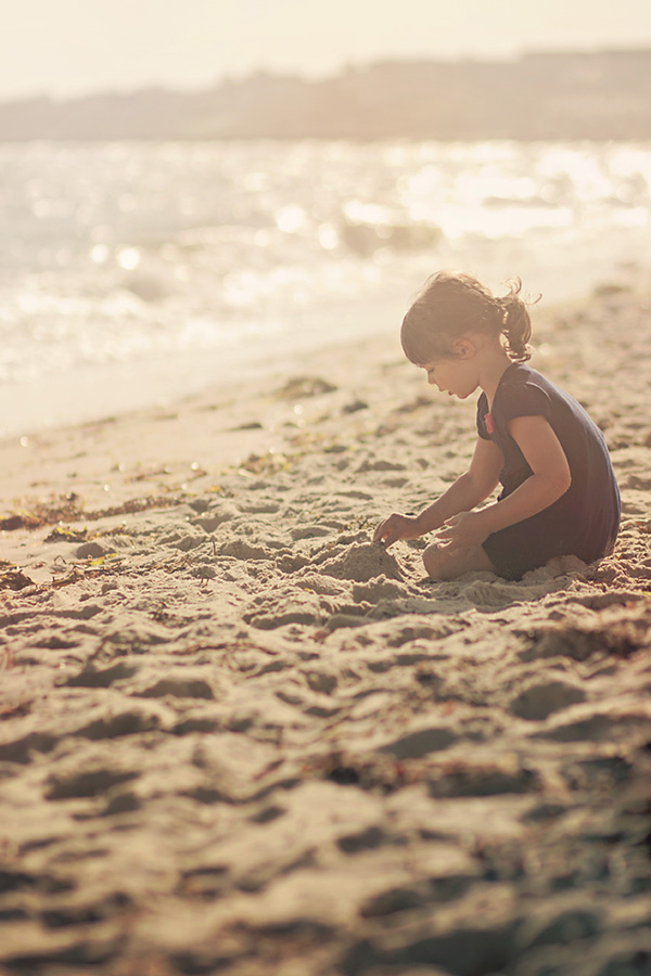 M playing with sand